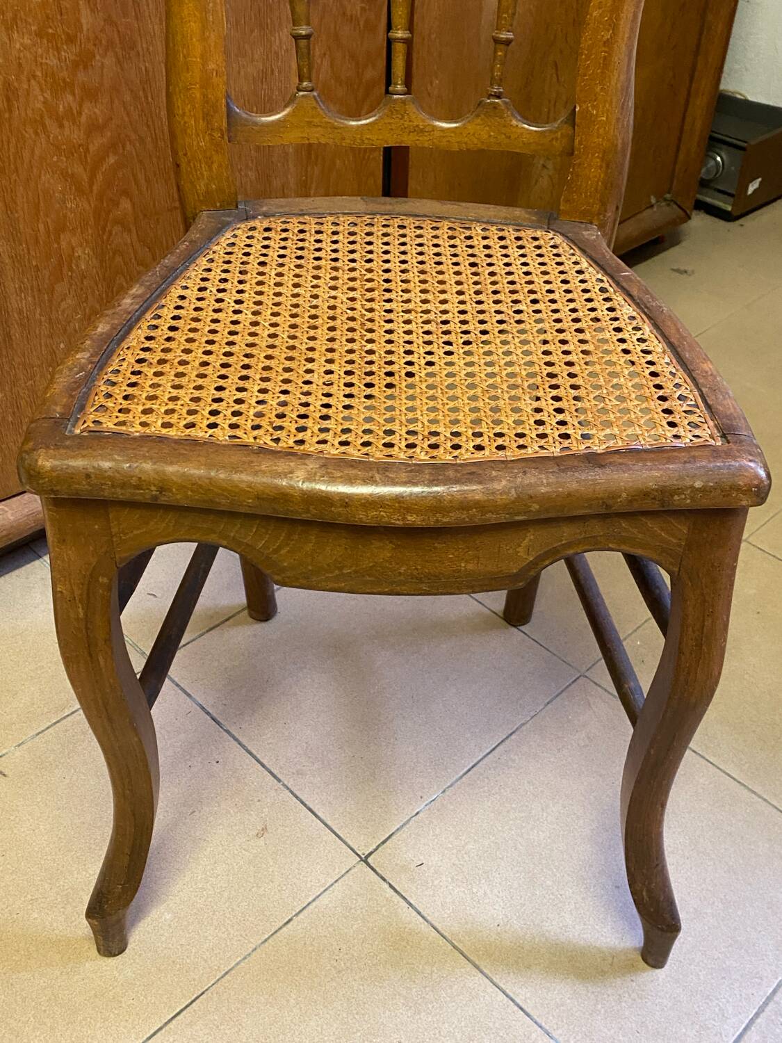 Antique wooden chair, cane seat