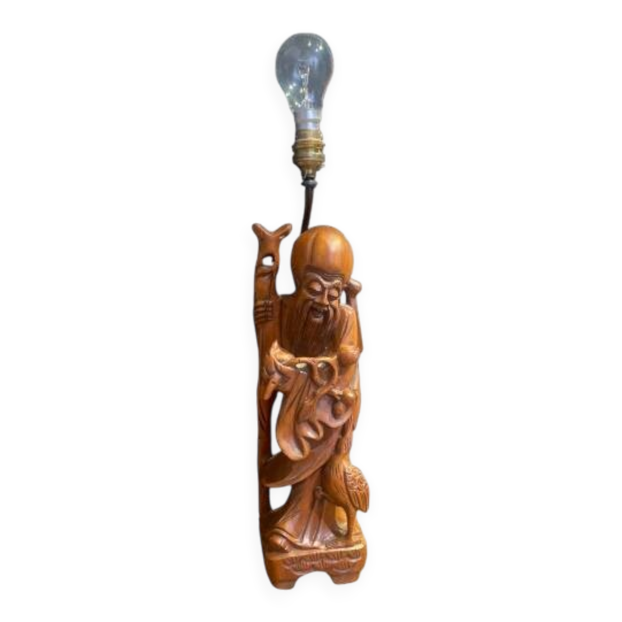 Carved wooden table lamp representing a man