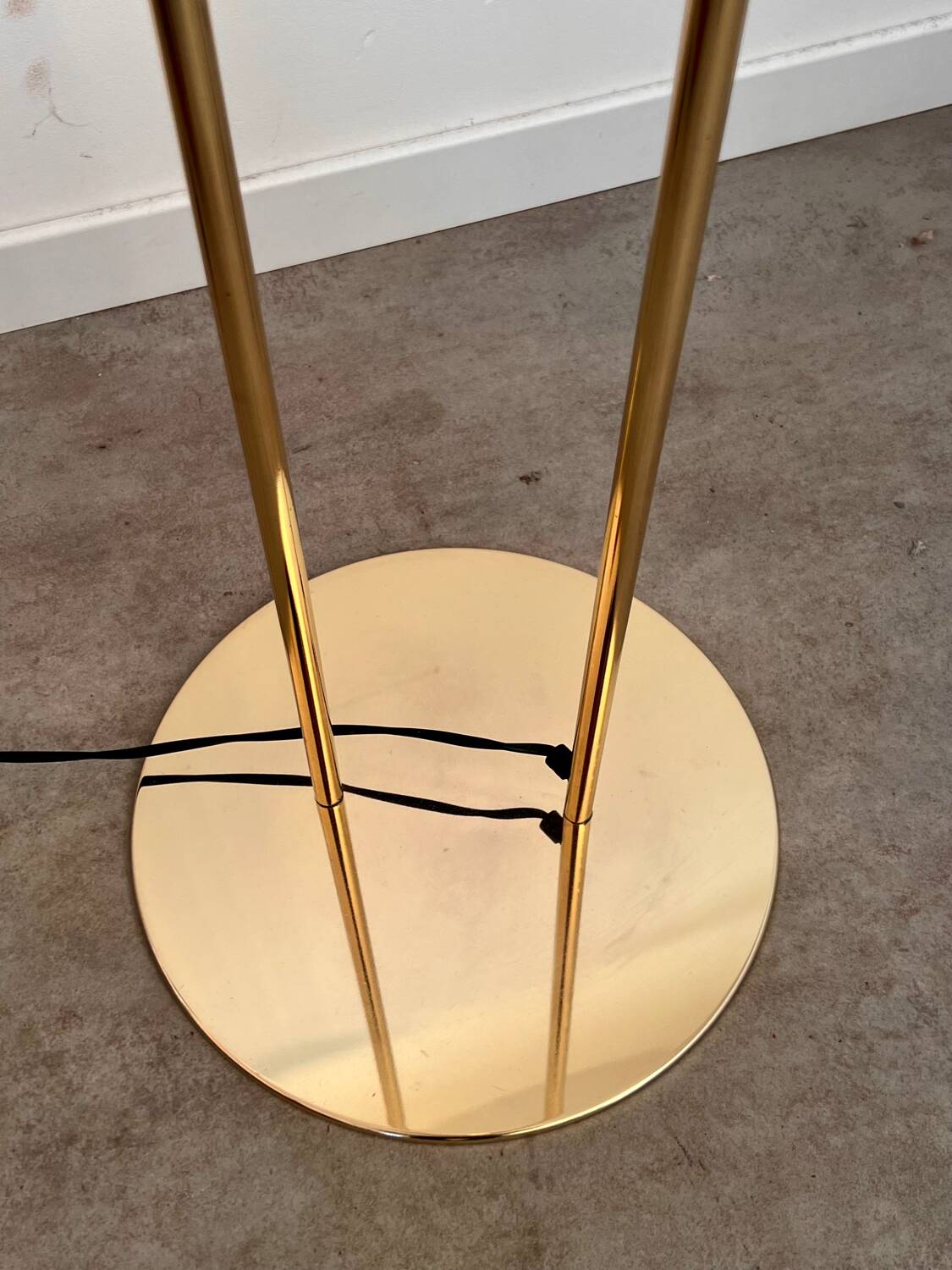 Old golden brass floor lamp with Italian design bulb from the 70s vintage