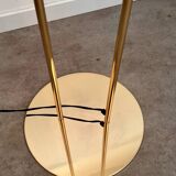 Old golden brass floor lamp with Italian design bulb from the 70s vintage