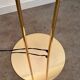 Old golden brass floor lamp with Italian design bulb from the 70s vintage