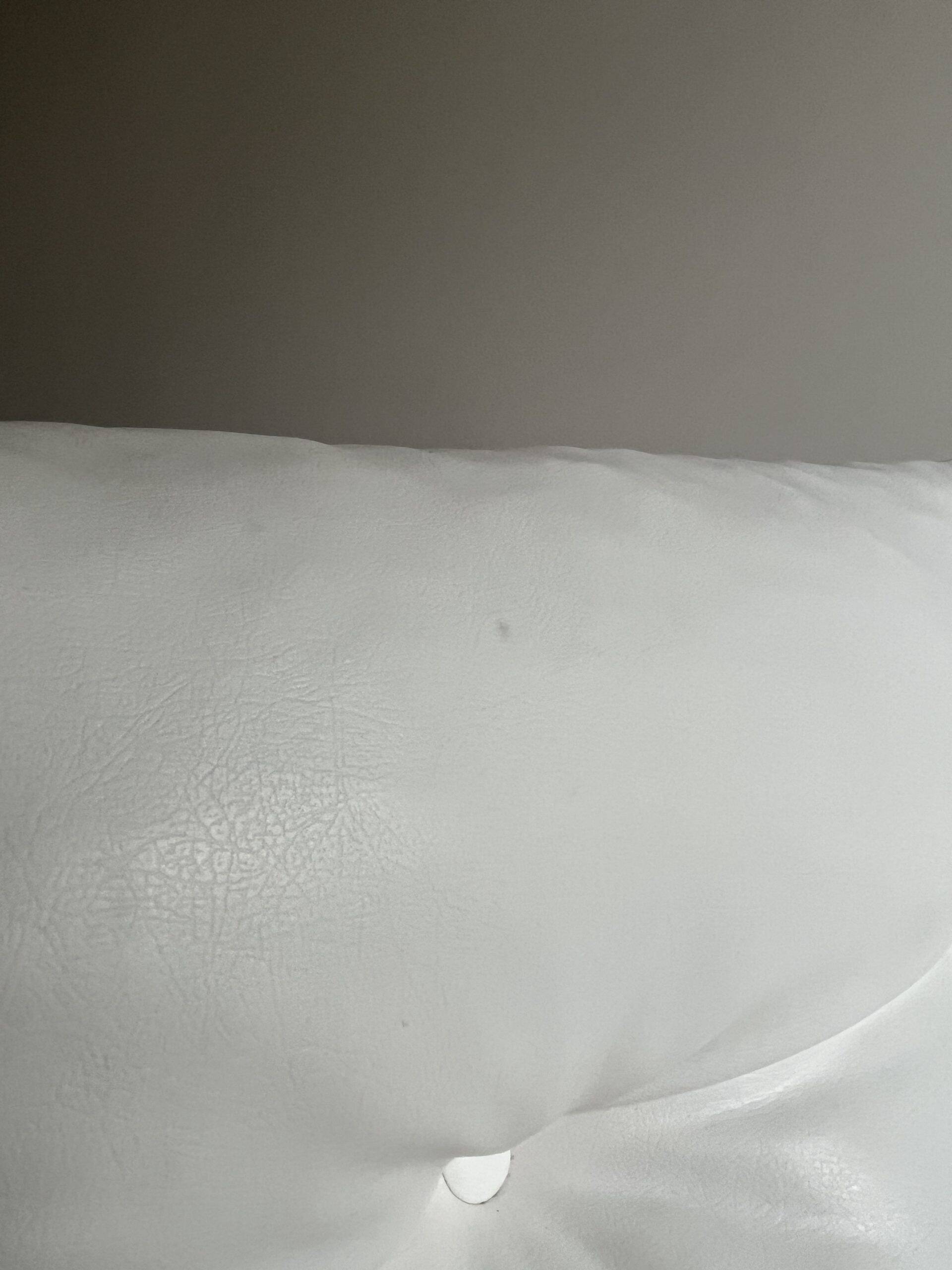 White faux leather armchair by Christian Koban for DOM edition