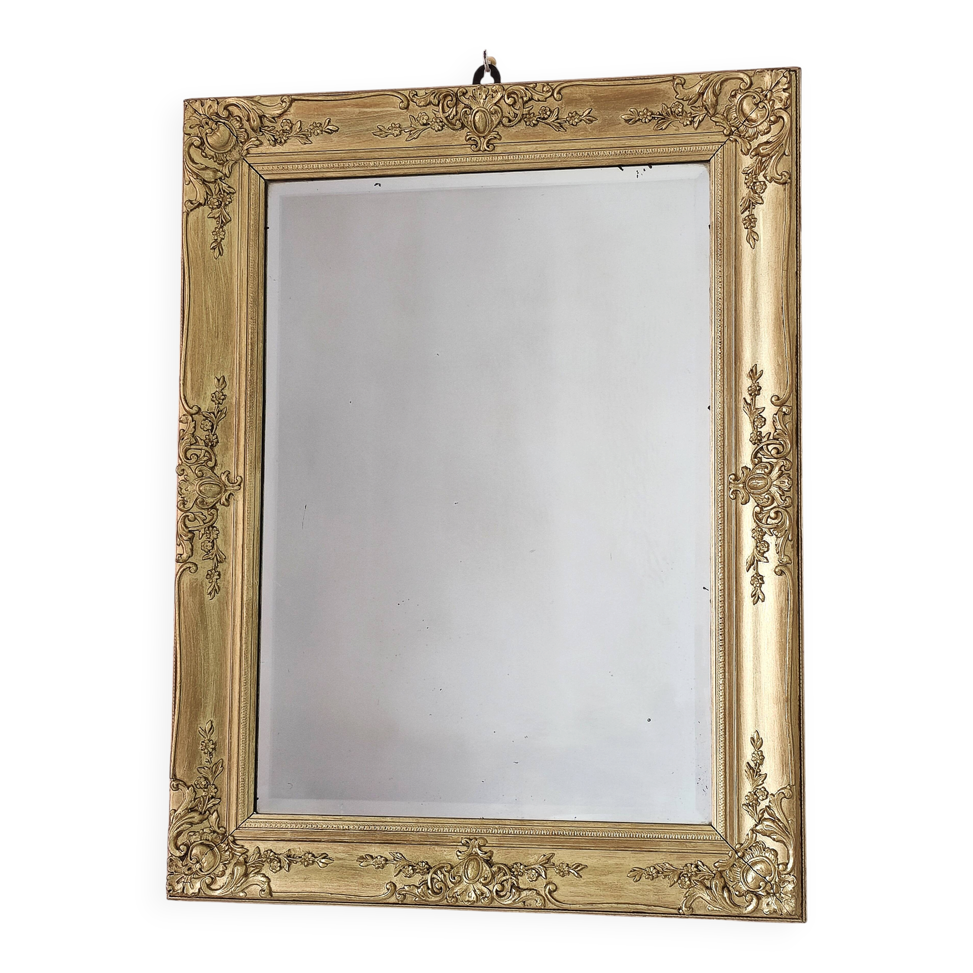 Richly carved antique gilded mirror
