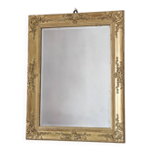 Richly carved antique gilded mirror