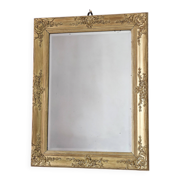 Richly carved antique gilded mirror