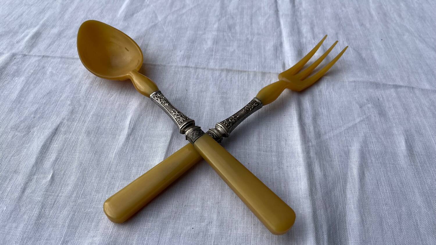 Old salad service in horn and silver metal