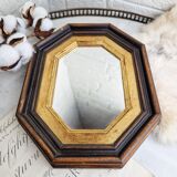 Antique mirror in black and gold octagonal wood