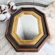 Miroir ancien en bois octogonal noir et doré