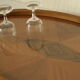 Oval wooden tray with glass and artisanal marquetry from the 70s.