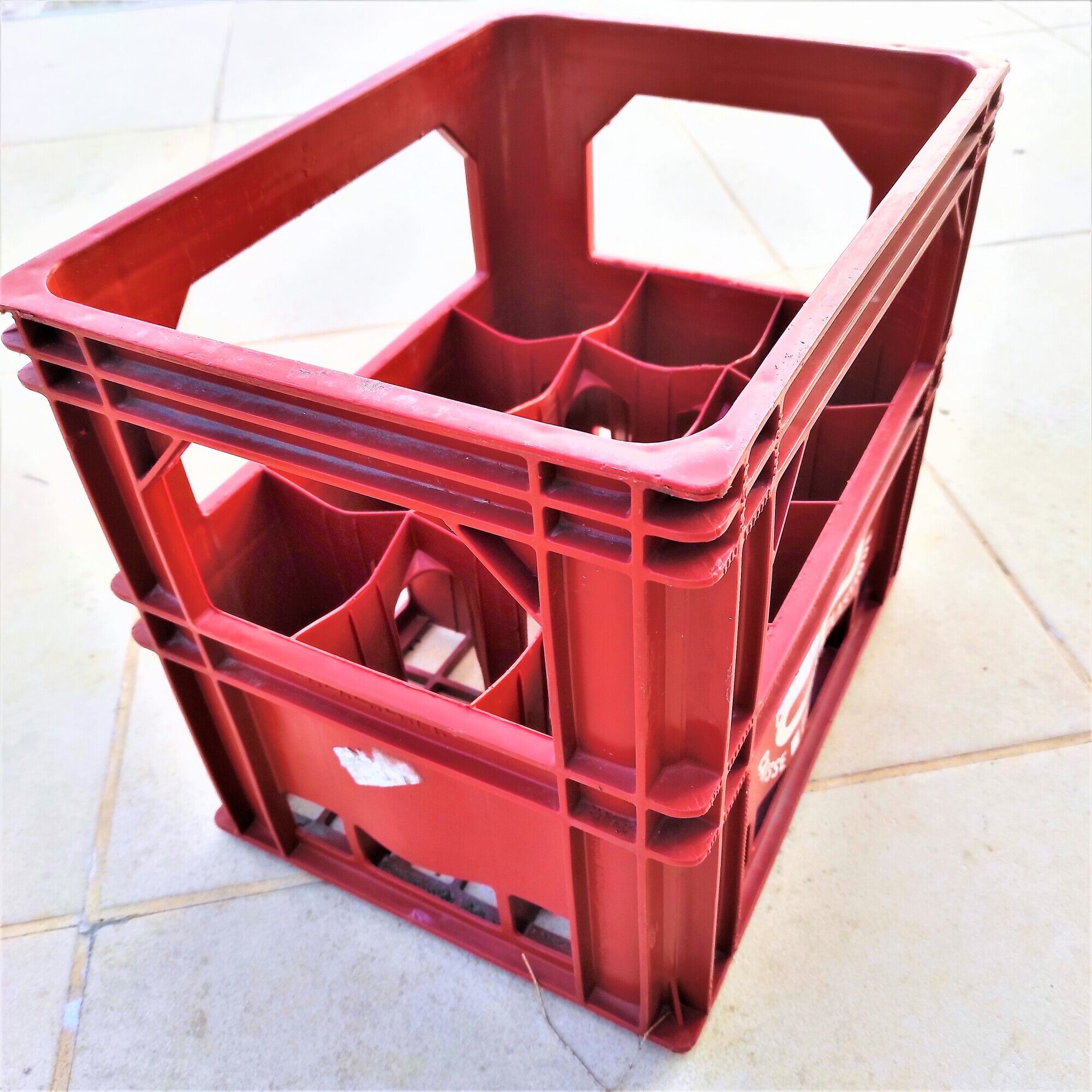 Locker with 12 red plastic bottles of the cfp brand around 1980