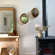 Oval mirror in gilded wood