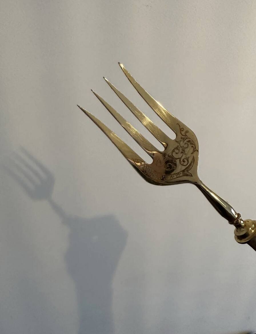 Engraved meat fork in silver and gold metal