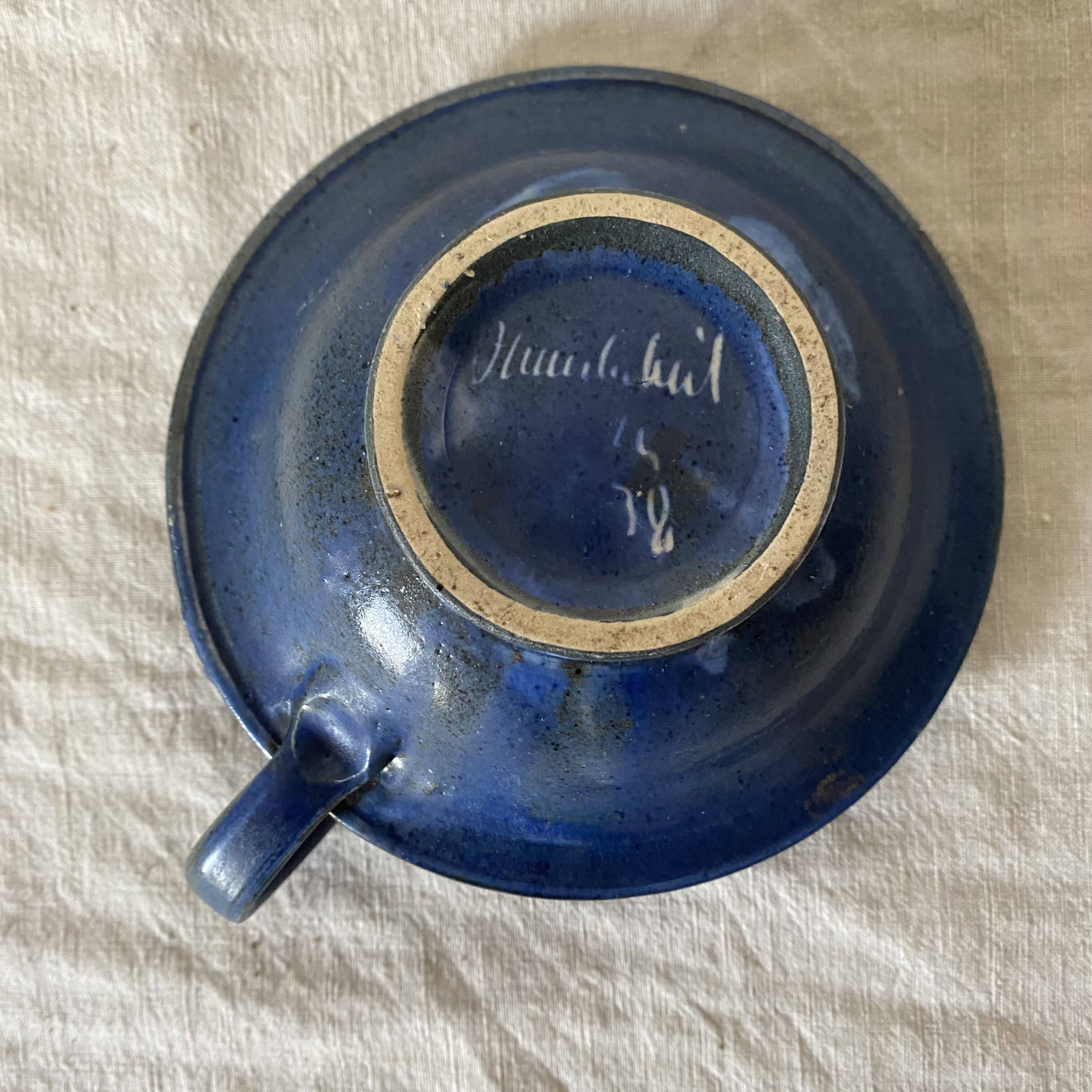 Signed terracotta thumb candle holder