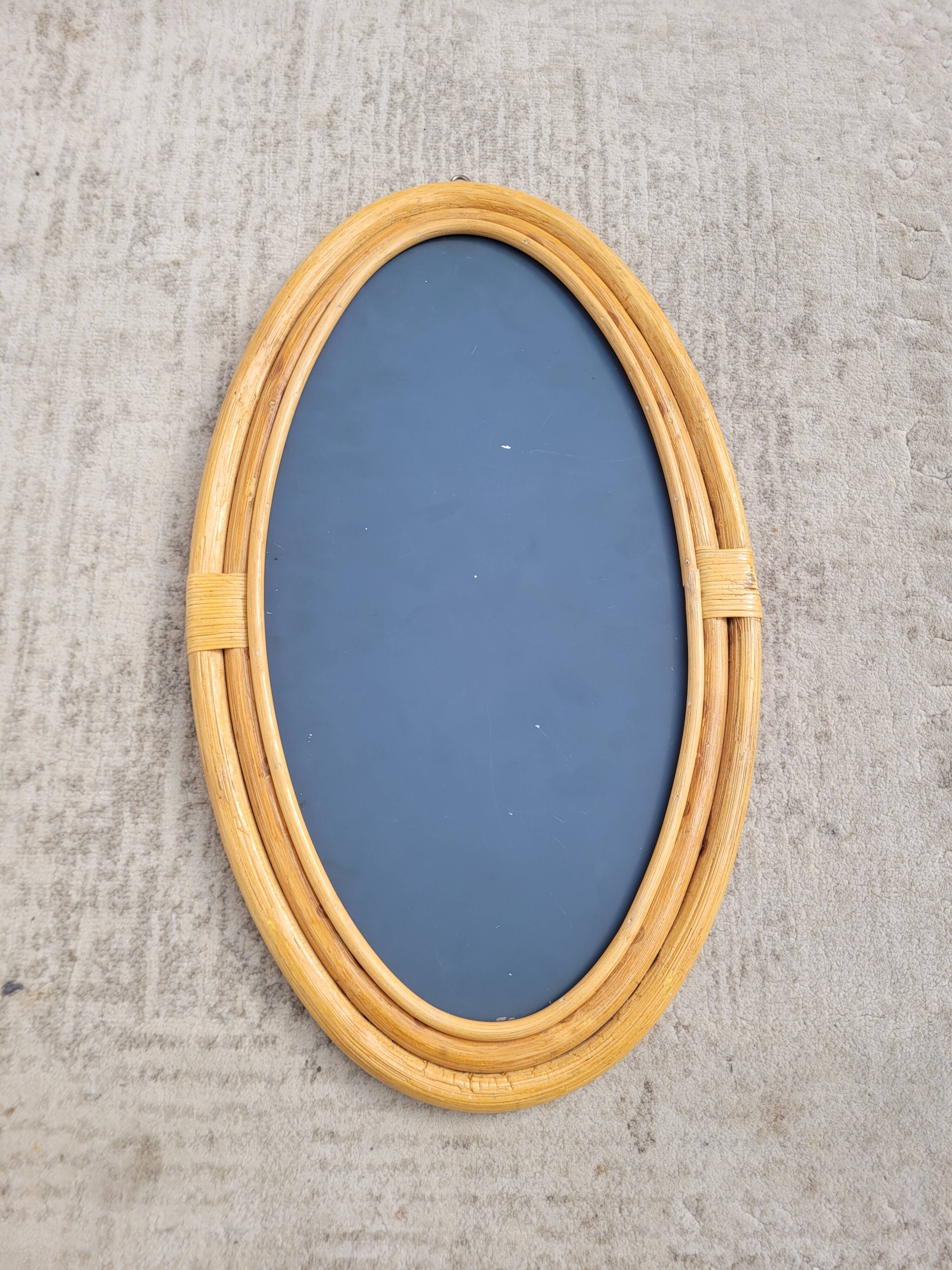 Oval rattan portrait mirror