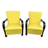 Pair of yellow Art Deco armchairs in cotton and wood, black frame, 1920s.