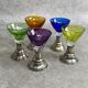 Set of 5 coloured stemmed glasses on silver stems.