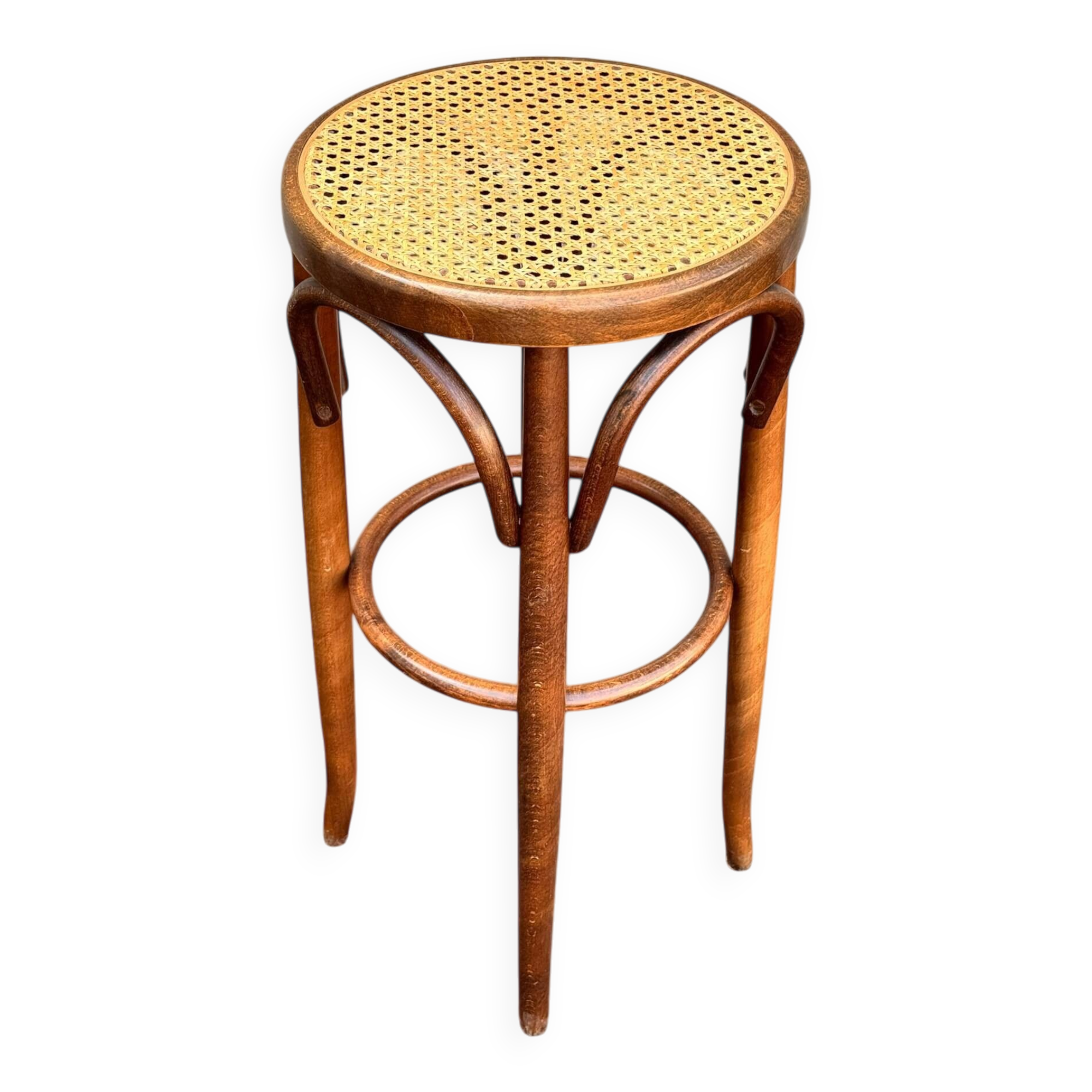 Old high stool in curved wood with caned seat