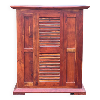 Exotic wood bar with 2 high stools.