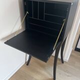 Secrétaire noir et feuilles d’or