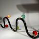 Coat rack in black lacquered metal and colored wooden balls