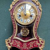 Boudoir clock on Louis XIV style console.