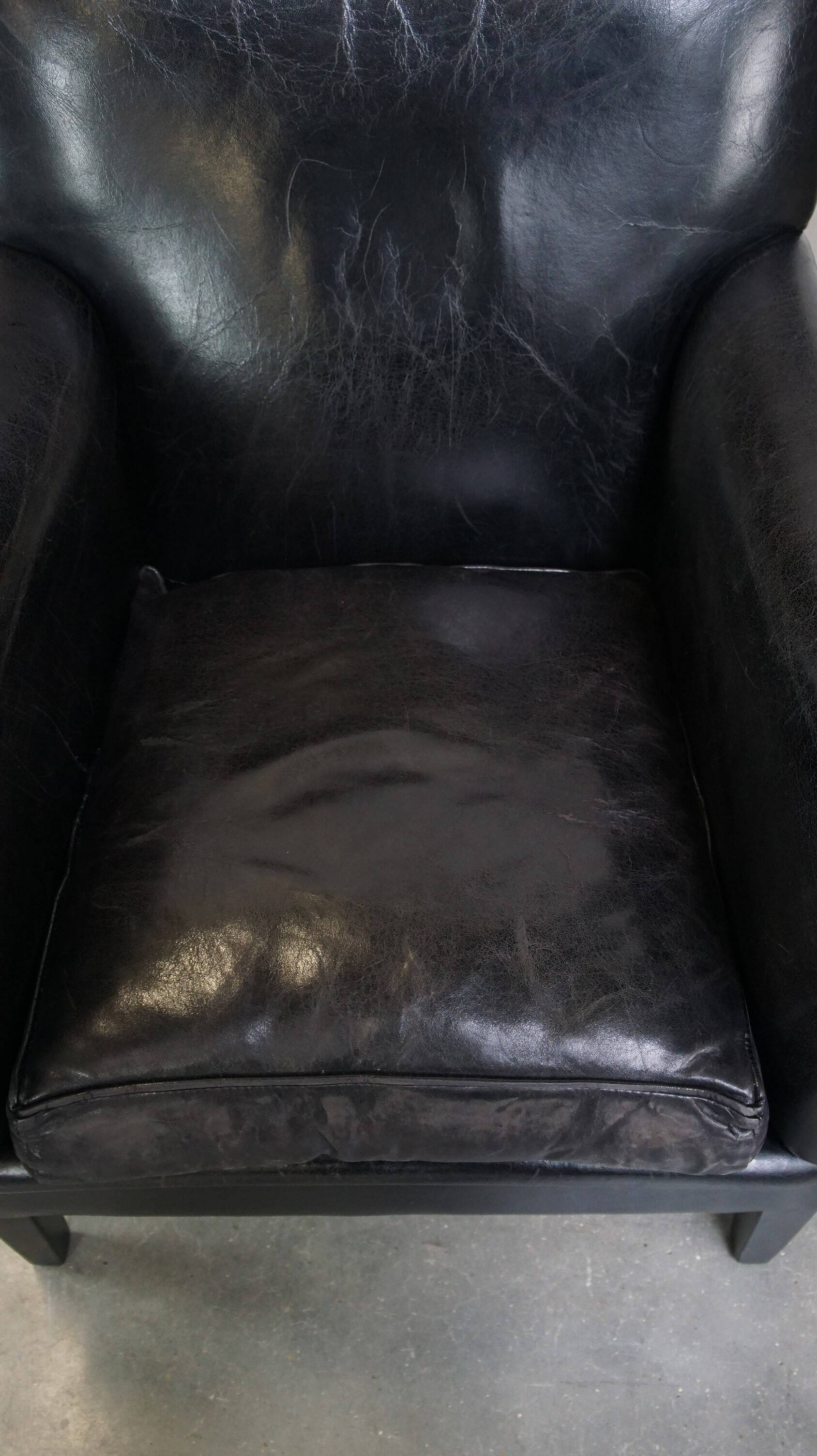Luxurious and comfortable sheepskin armchair in a unique, stately black color