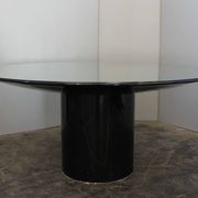 Black lacquered glass table and glass in the hoof style, Italy.
