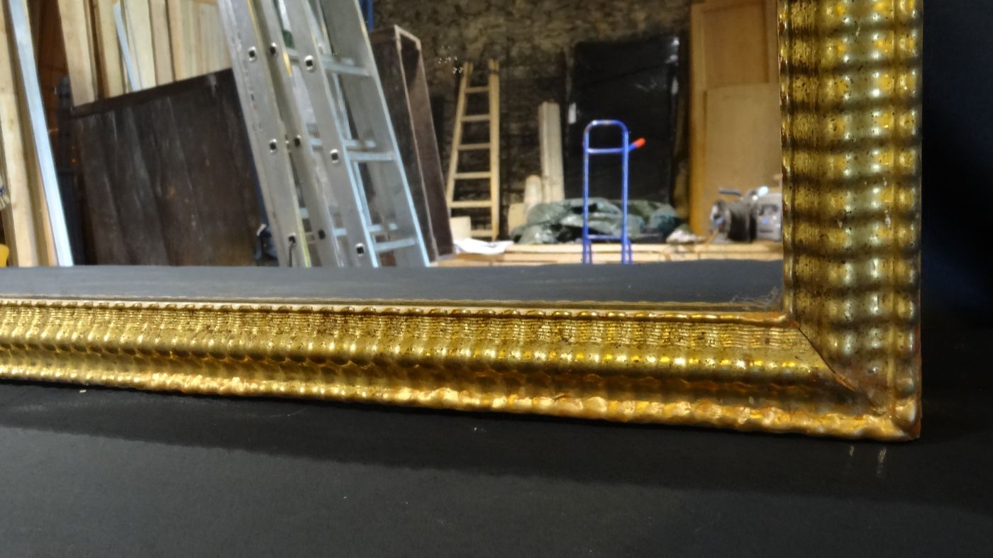 Gilded stucco mirror with gold leaf, H 152 cm