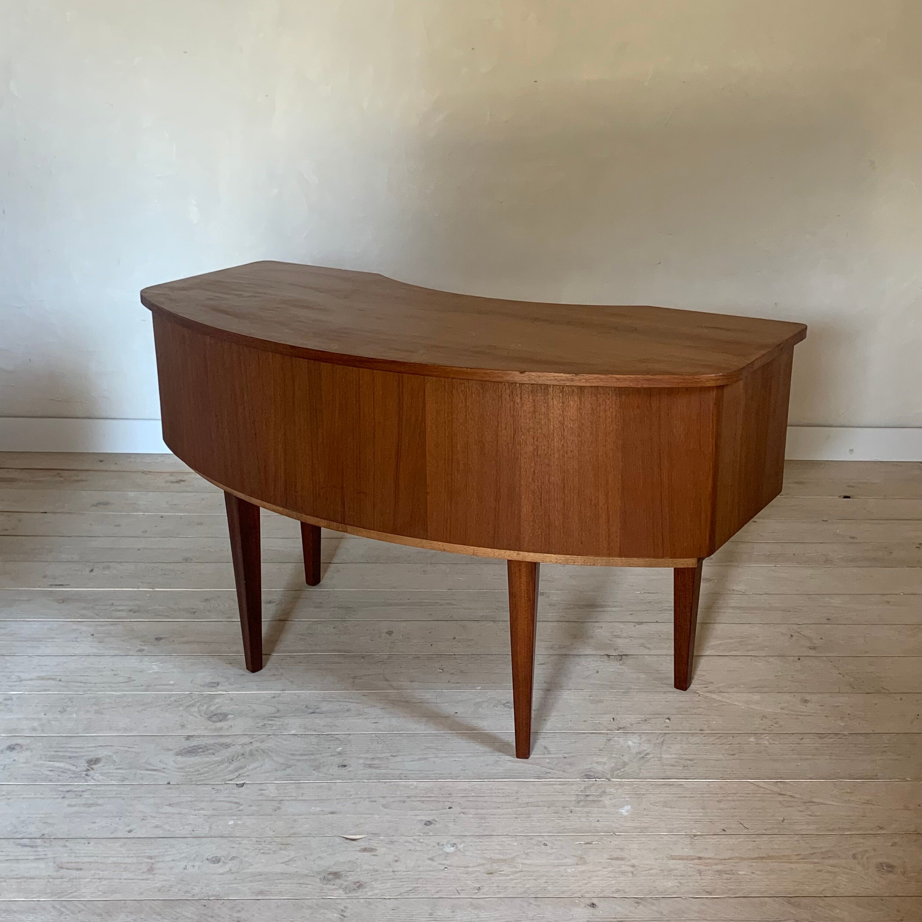 Vintage curved teak desk