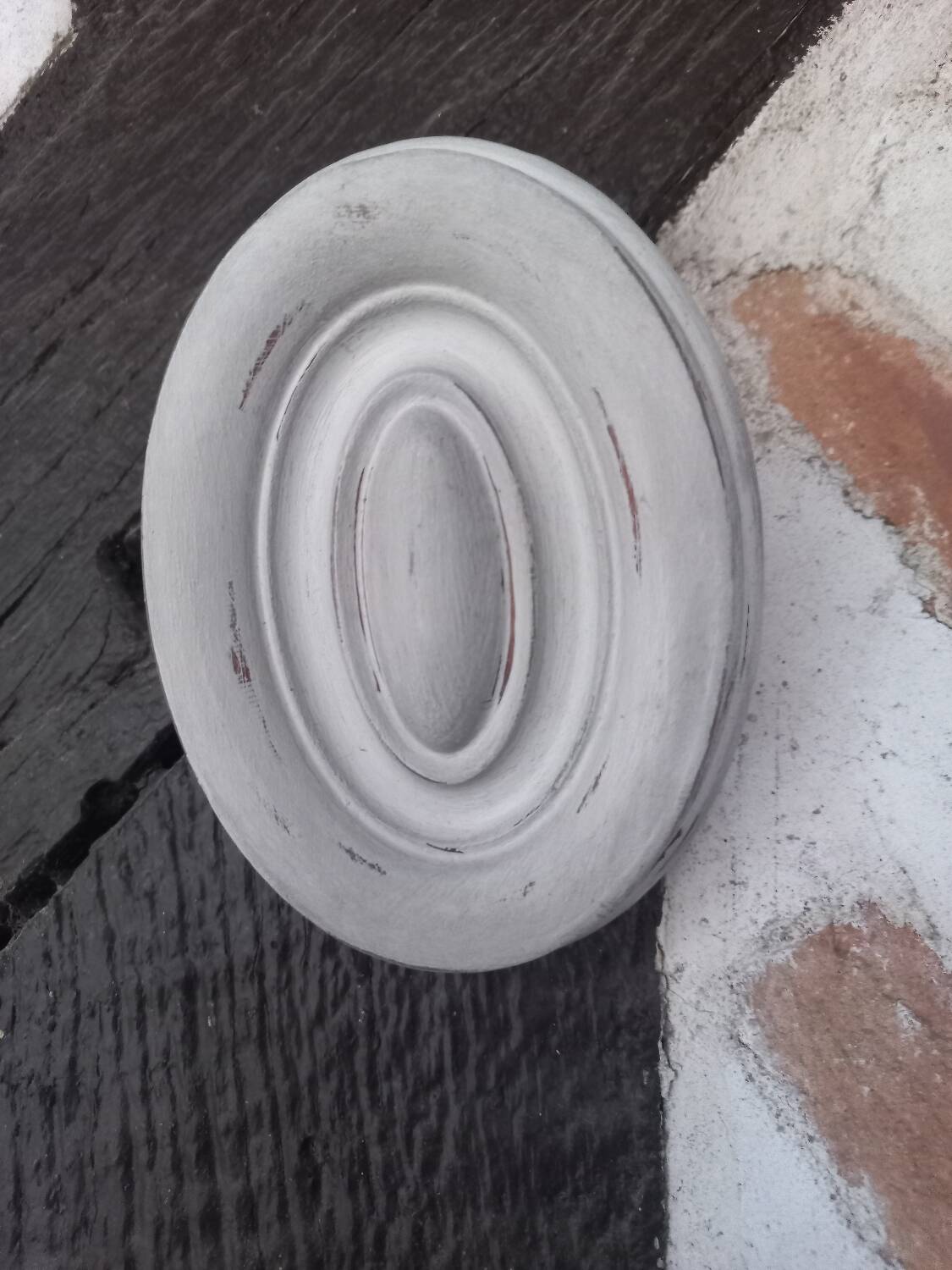 Pair of patinated oval woodwork