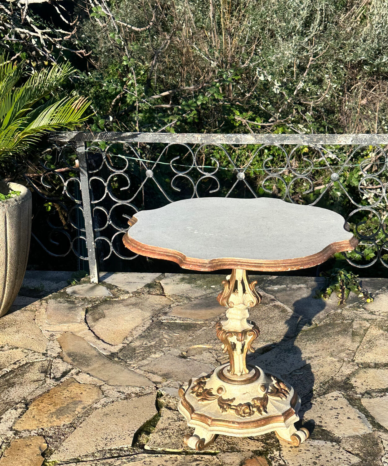 Carved and lacquered wooden side table.