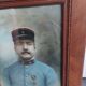 Antique wooden frame with carved portrait knot