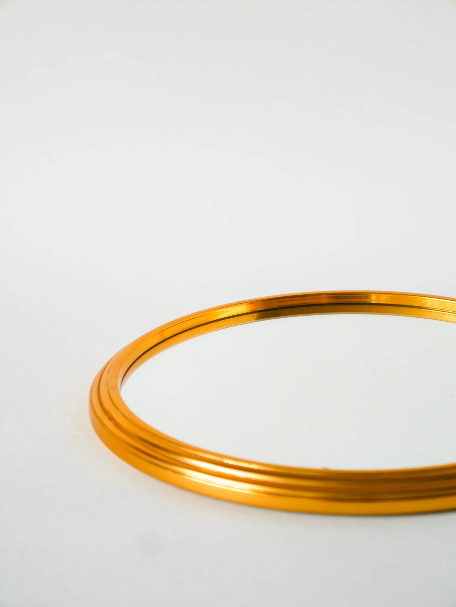Small round mirror tray, gold, 1960