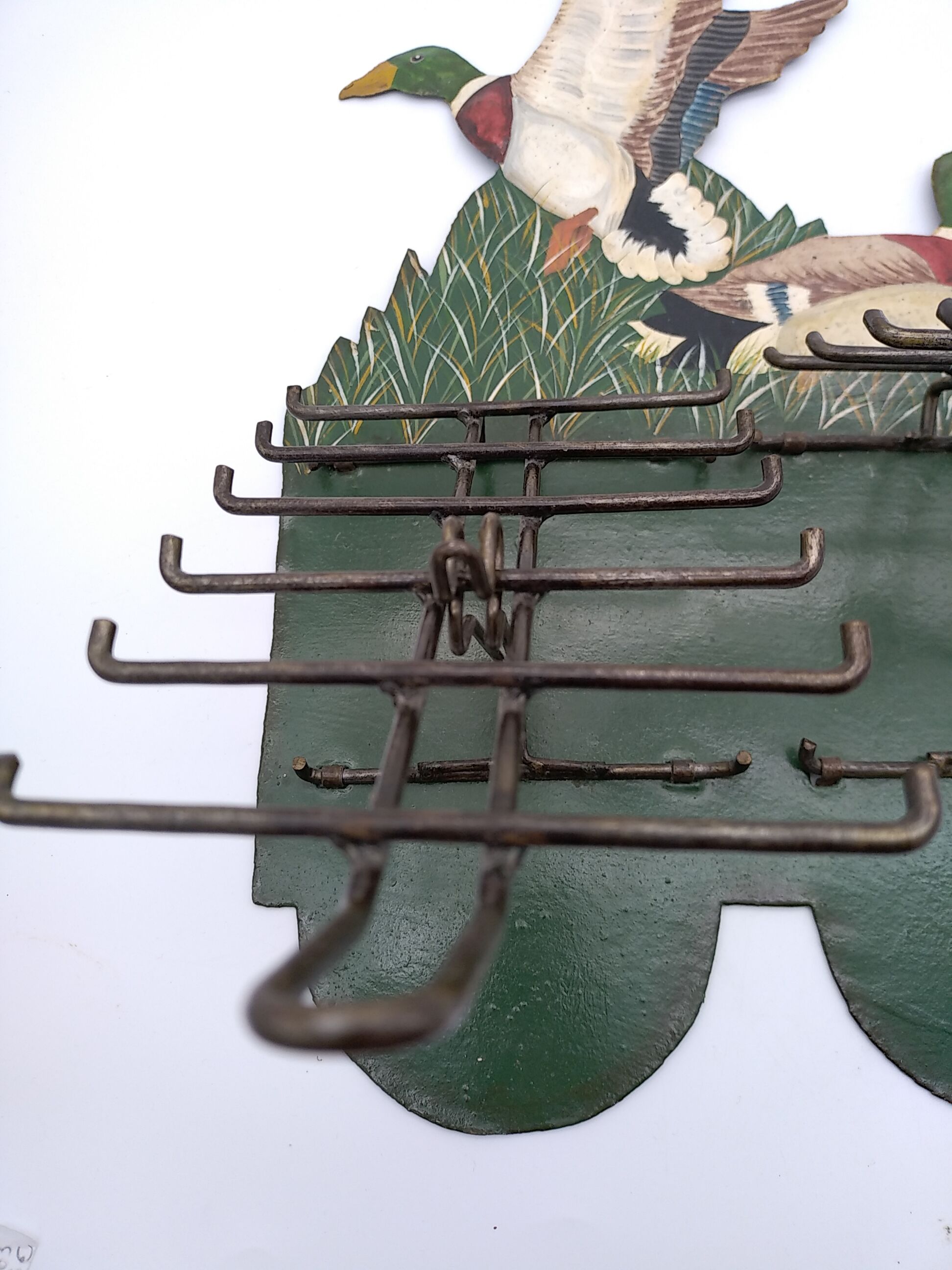 Metal wall tie door with duck decoration. 50s .