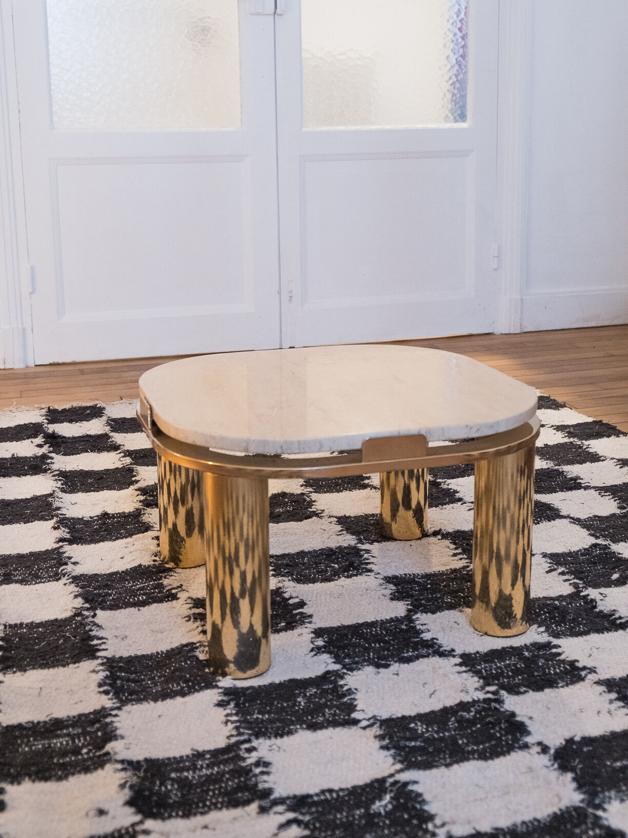 Travertine side table and vintage brass