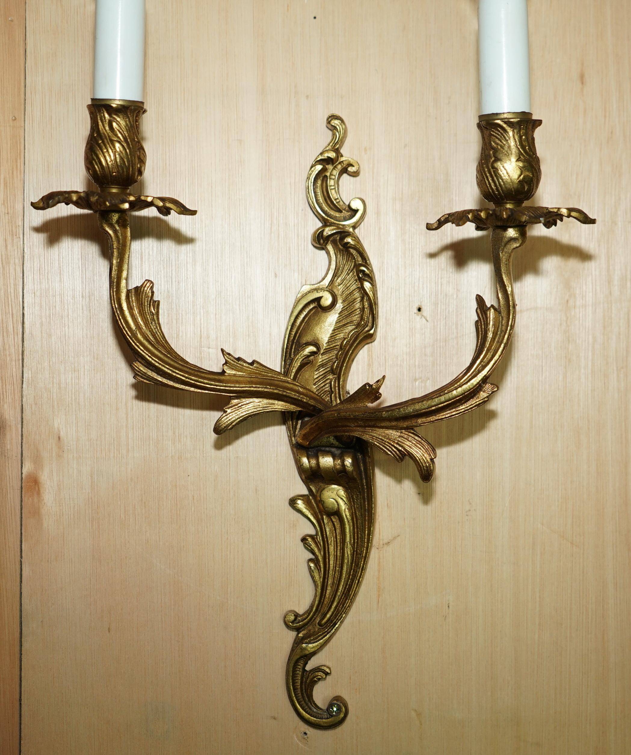 Pair of antique French wall sconces, gilded and bronzed, from the 1920s.