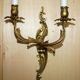 Pair of antique French wall sconces, gilded and bronzed, from the 1920s.