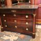 Commodity with mahogany detached columns and Empire gilded bronze ornaments