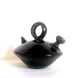 Chevrette modernist in black enamelled sandstone, circa 1970