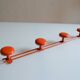 Vintage 70s orange lacquered metal 4-hook wall coat rack