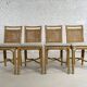 Suite de 4 chaises en rotin cannage et laiton