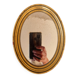 Old golden oval mirror