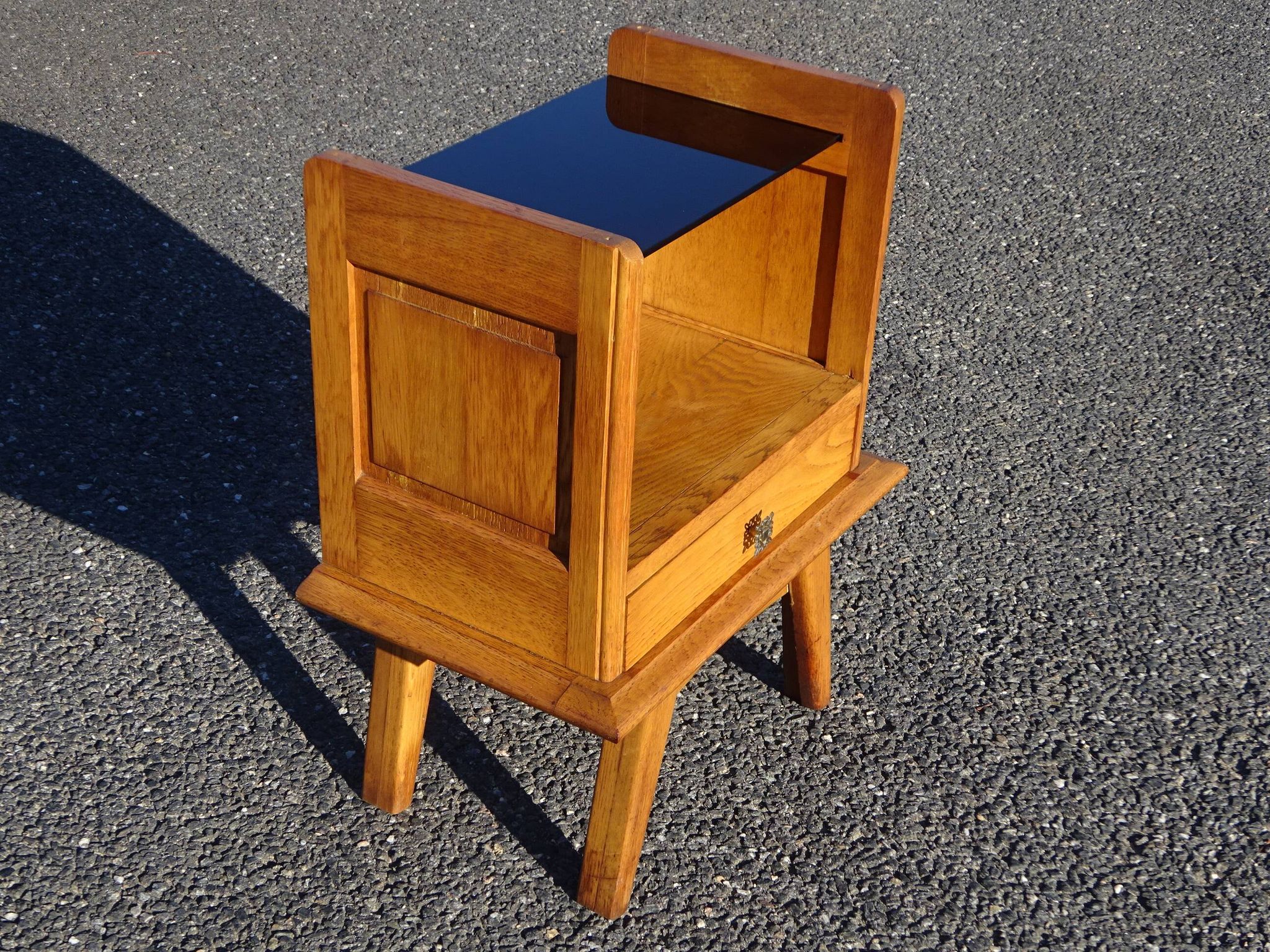 Vintage oak bedside table with tapered legs.
