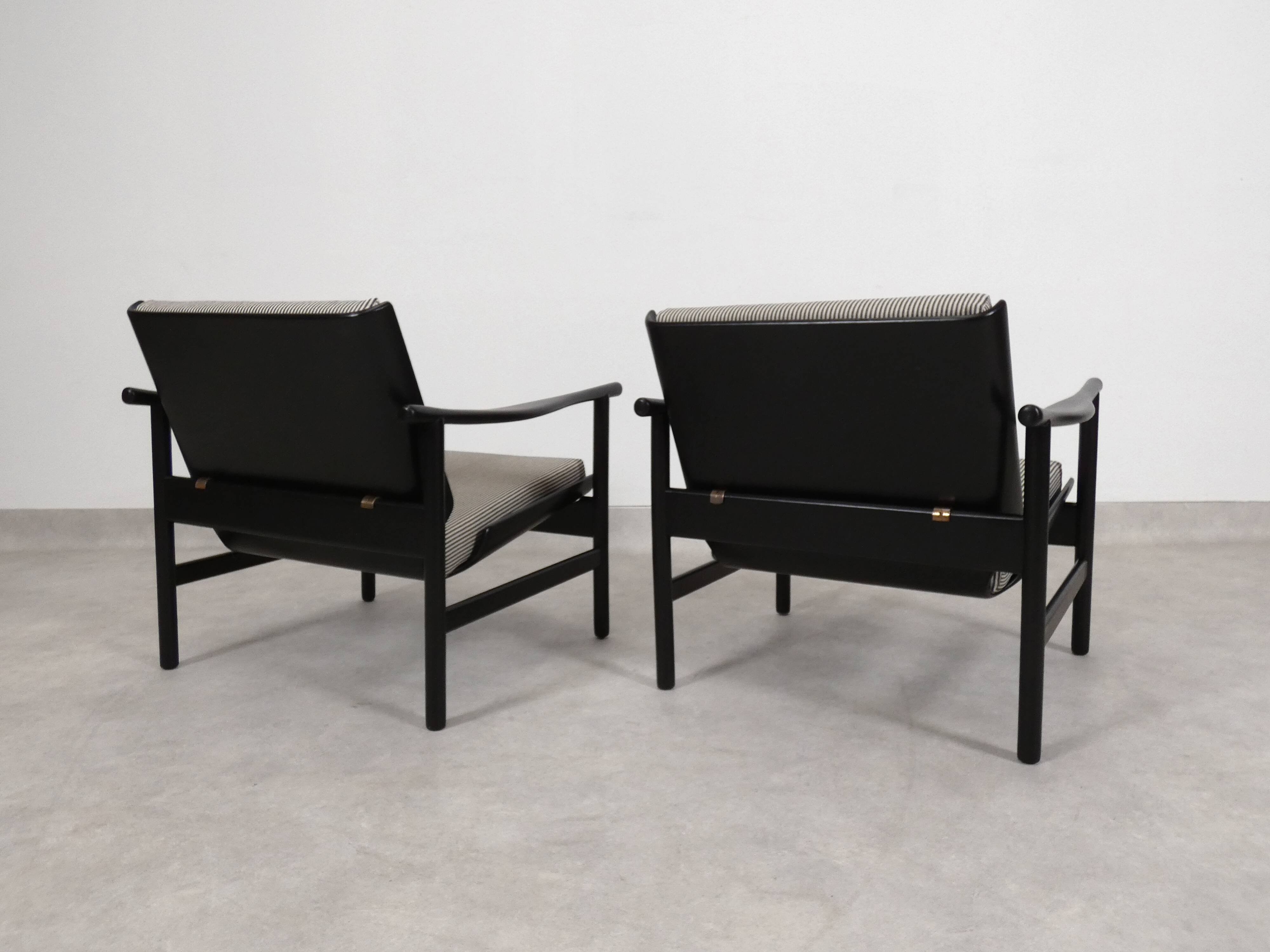 2x wooden Scandinavian arm chairs