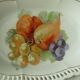Pierced porcelain basket decorated with fruit still life.