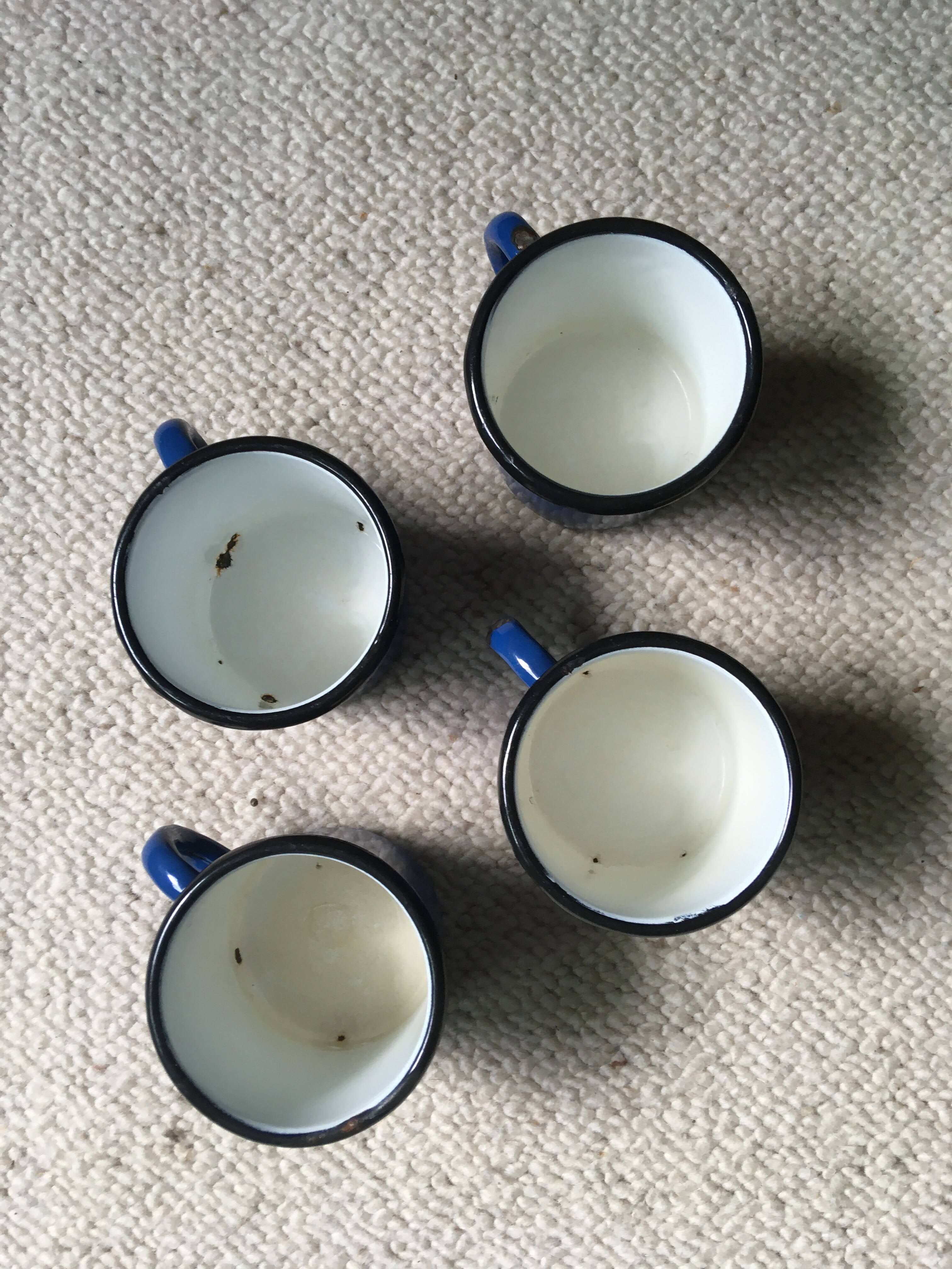 Batch of 4 enamelled sheet metal mugs