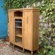 Asymmetrical Art Deco glass-fronted Parisian wardrobe in raw oak, 1930.