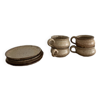 4 stoneware coffee cups and saucers