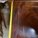 Antique mahogany secretary, upholstered flap and interior storage