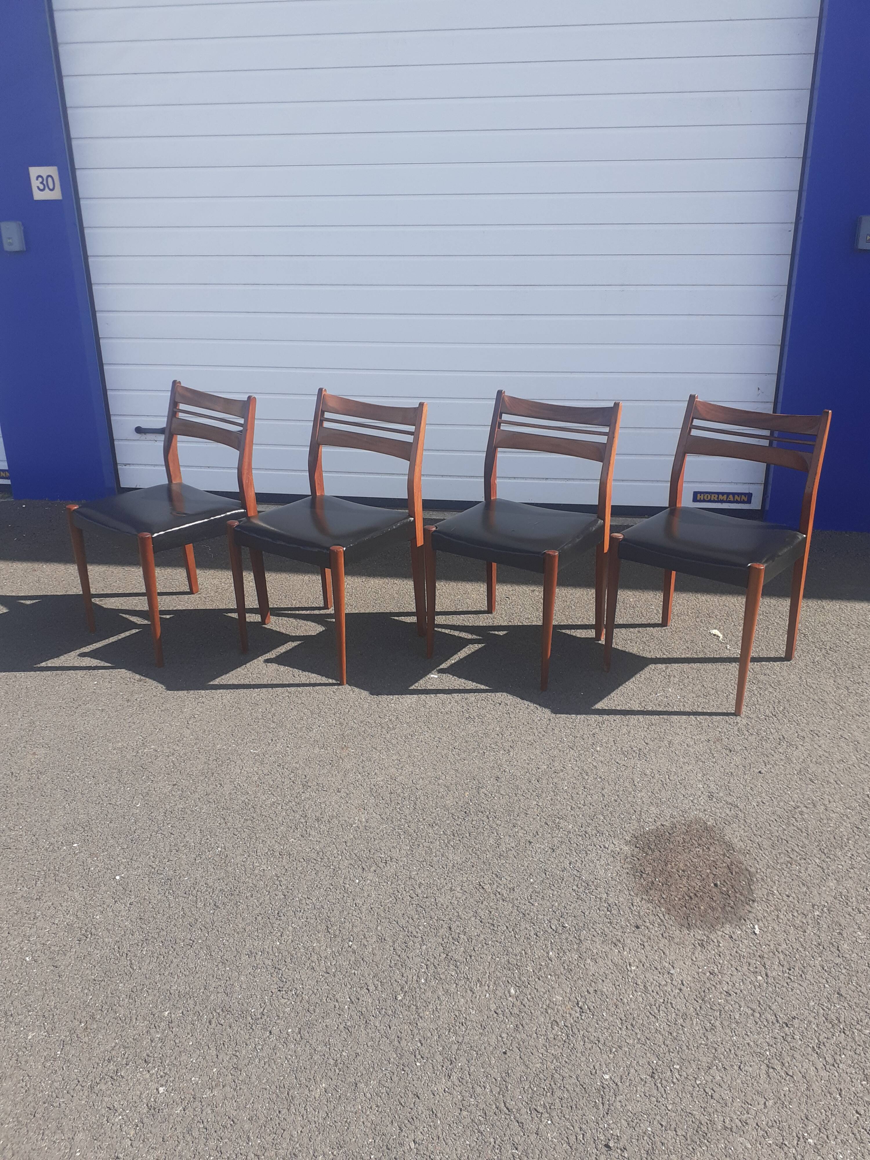 Scandinavian chairs in teak and black skaï.
